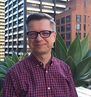 Picture of Peter Marshall wearing a red and blue check shirt. Manager of Data Team at website Mozo