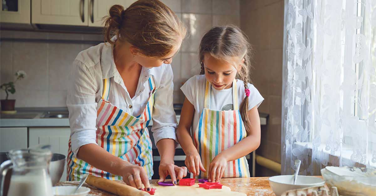 Mother and daughter baking on holidays