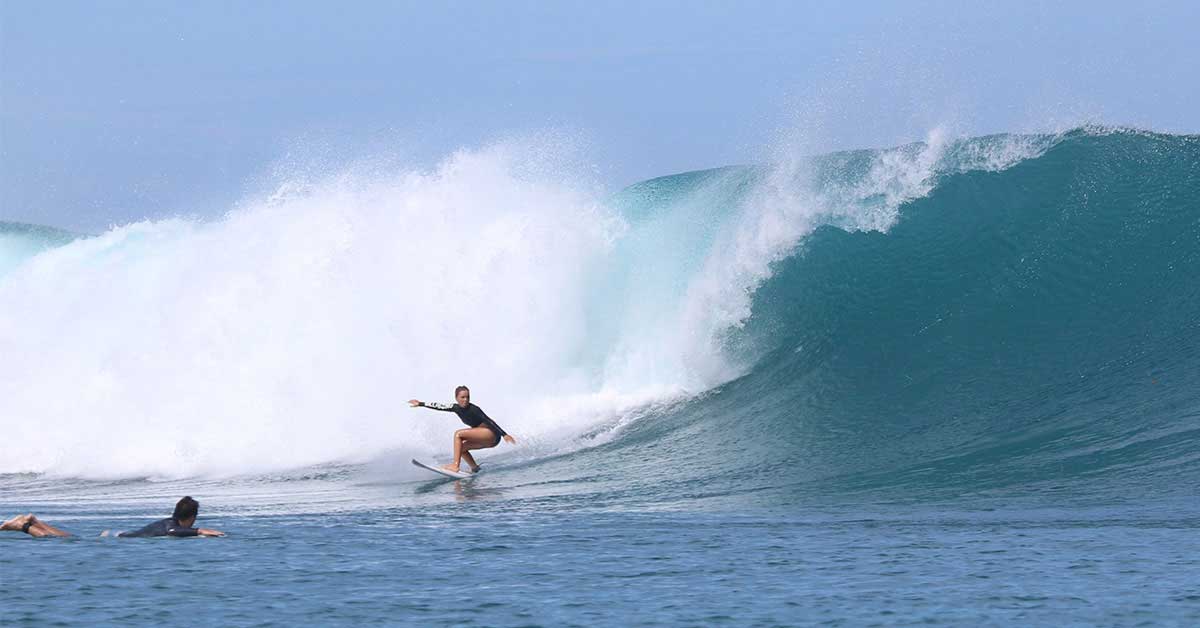 Person surfing big wave